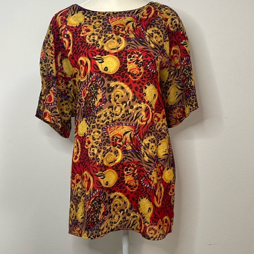 Truffles Woman short sleeve blouse.  Sun and leopard print.  Size 2X.